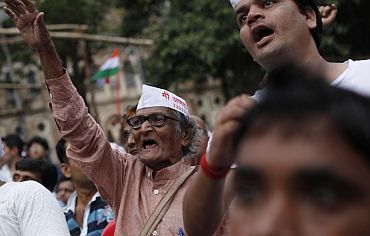 Supporters of Anna Hazare shout slogans at a rally against corruption in Mumbai
