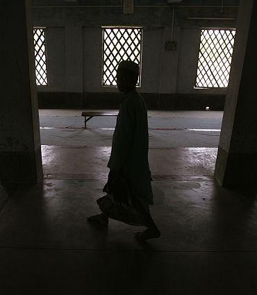 A boy inside a classroom in a madrassa at Nandigram village