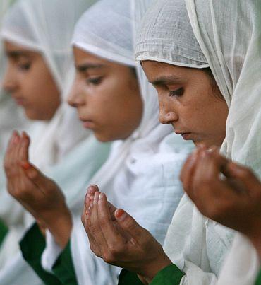 Muslim girls pray in a madrassa in Jammu