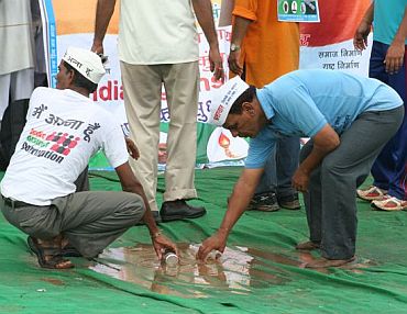 IAC volunteers trying to drain out water