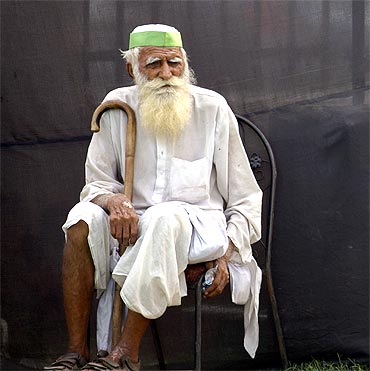 A supporter of Anna Hazare sits on a chair at the Ramlila grounds on Sunday