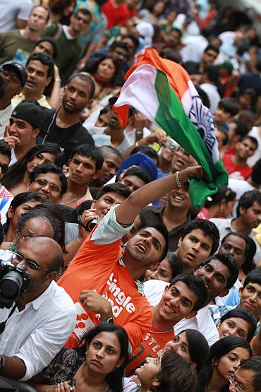 A young Indian American waves the tricolour