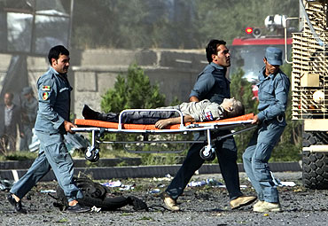 A casualty is carried away from the site the attack in Kabul