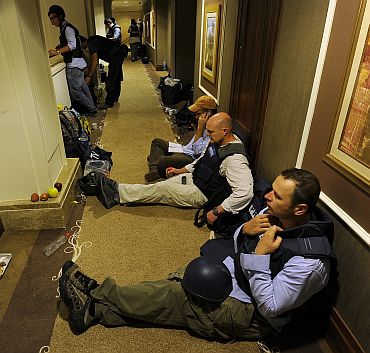 Members of the media gather in the corridors of the Rixos hotel in Tripoli
