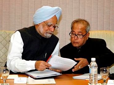 File picture of PM Singh with Finance Minister Pranab Mukherjee