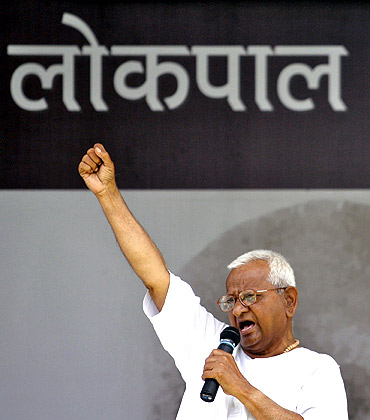 Anna Hazare shouts slogans as he addresses his supporters on the tenth day of his fasting at Ramlila grounds in New Delhi