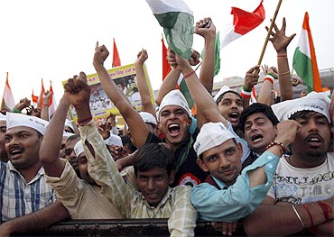 Supporters of Anna Hazare shout slogans at the Ramlila Maidan