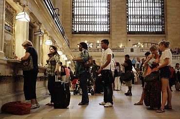 Travellers wait in line for Metro North tickets at New York's Grand Central Station