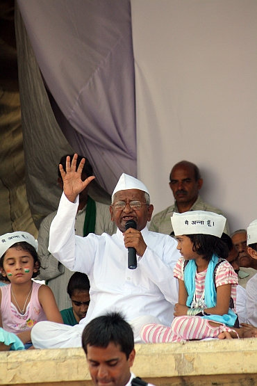 Hazare waves to his supporters at Ramlila Maidan