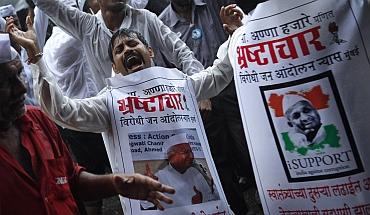 Supporters of Hazare dance in Mumbai on Sunday