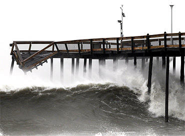 Waves break along the pier which was damaged during Hurricane Irene, in Ocean City, Maryland