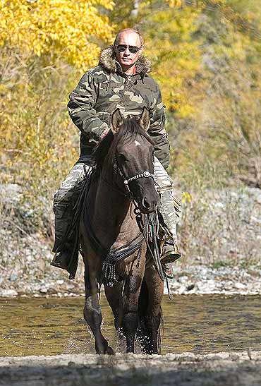 Putin rides a horse as he takes part in an expedition to Ubsunur Hollow Biosphere Preserve to inspect the snow leopard's habitat in Tyva Republic in the Siberian Federal District