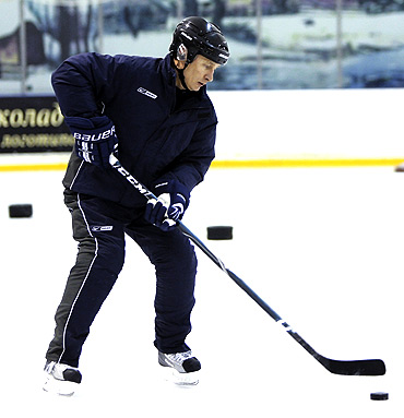 Putin attends an ice hockey training session in Moscow