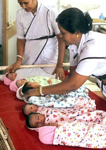 Nurses take care of newly born babies inside a ward of a maternity hospital in Agartala.