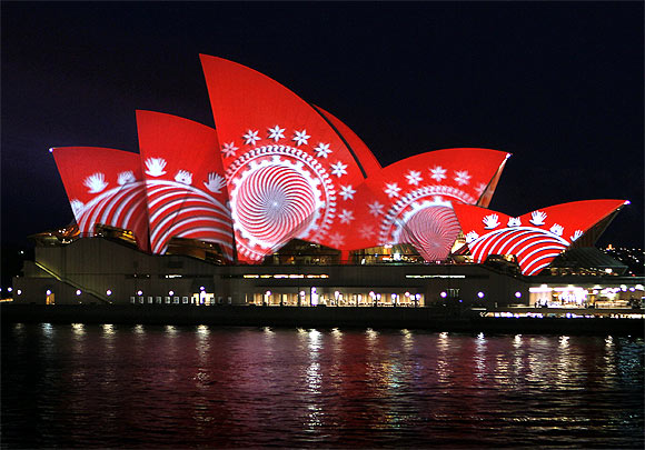 The sails of the Sydney Opera House turn red during a World Aids Day reception in Sydney