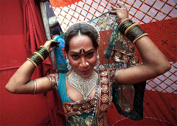 Raksha, 25, a sex worker, prepares for a performance in Mumbai's Kamathipura red light district
