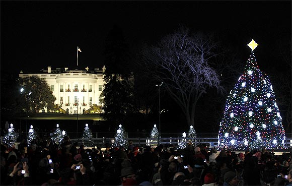 The National Christmas Tree is lit in front of the White House during its lighting ceremony in Washington