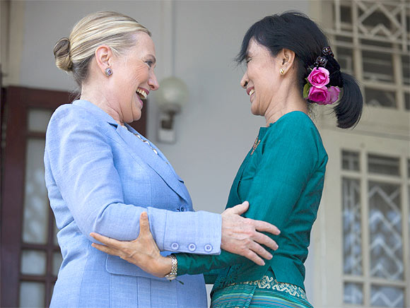 Suu Kyi and Clinton embrace after their meeting at Suu Kyi's residence laying out a framework for reforms