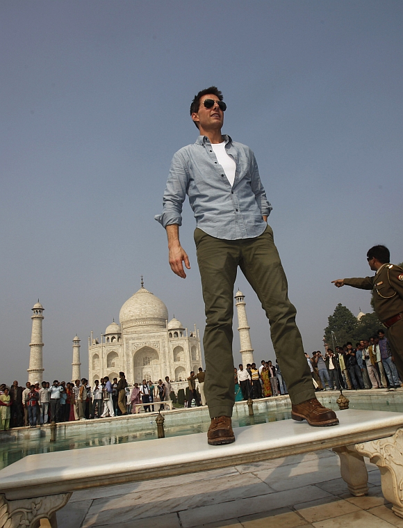 Actor Tom Cruise poses for photographers at the historic Taj Mahal in Agra