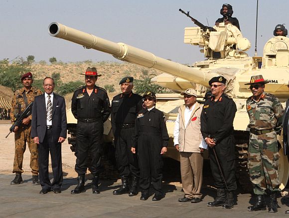 Patil stands before the T-90 tank that she rode during the Strike Corps Offensive Operation by GOC-in C Southern Command and GOC 21 Corps, at Pachpadra, Rajasthan on December 05. Defence Minister A K Antony is also seen