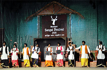 Soldiers from the Indian Army's 18 Sikh Regiment perform the bhangra at the Manipur state tourism department's Sangai Festival. In a bid to win over the public, the army has taken to civic-military programmes where they give assistance for constructing community buildings, provide TVs for local clubs, etc