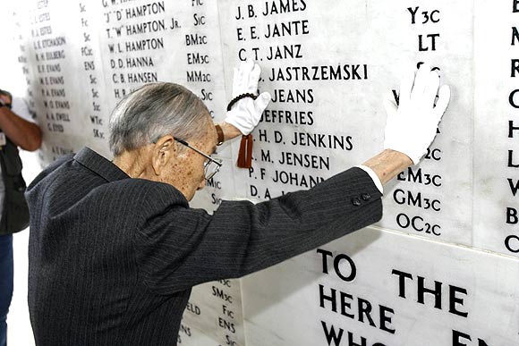 Zenji Abe, a Japanese pilot who attacked Pearl Harbor on December 7 1941, pays respects at the memorial wall at the USS Arizona