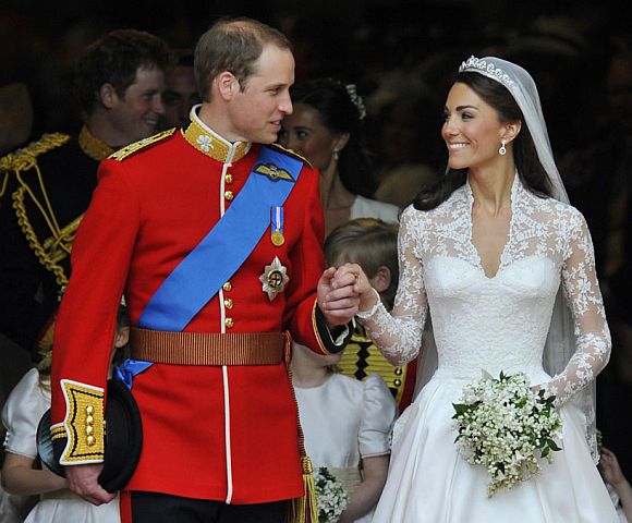 Britain's Prince William (L) and Catherine, Duchess of Cambridge, look at one another after their wedding ceremony in Westminster Abbey, in central London April 29, 2011