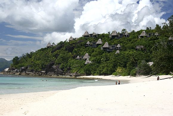 A general view shows tourists on the sandy beaches outside the Seychelles capital Victoria