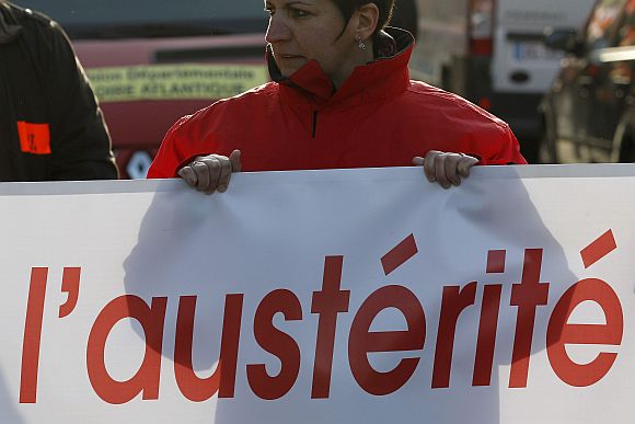 Private and public sector workers take part in a demonstration to protest against austerity measures in Nantes, France