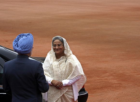 PM Singh greets Bangladesh PM Sheikh Hasina during the latter's visit to India