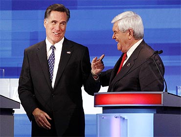 Former Massachusetts Governor Mitt Romney (L) and former US Speaker of the House Newt Gingrich (R-GA) at the Iowa debate