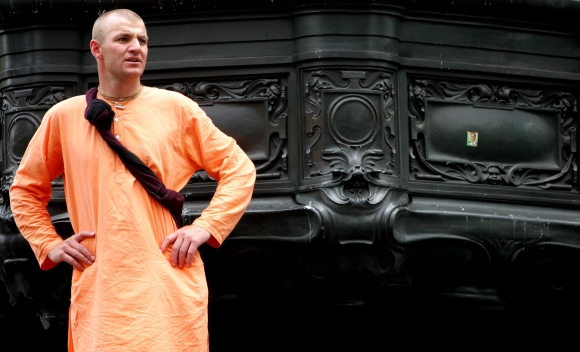 A Hare Krishna devotee watches the Ratha Yatra Chariot Carnival