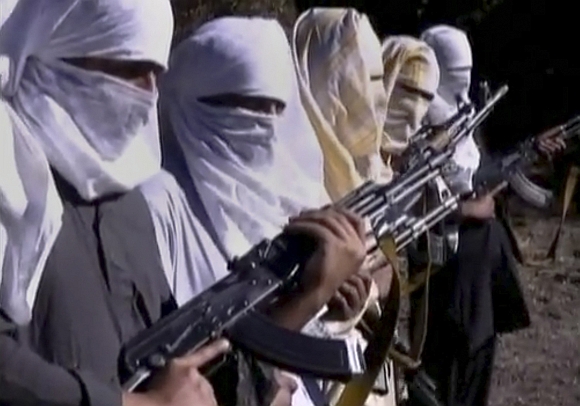 Pakistani Taliban fighters hold weapons as they receive training in Ladda, South Waziristan tribal region, in this still image taken from a video, shot between December 9 to December 14