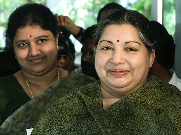 Jayalalitha arrives with Sasikala Natarajan and an unidentified woman at a polling booth in Chennai in this May 10, 2001 picture