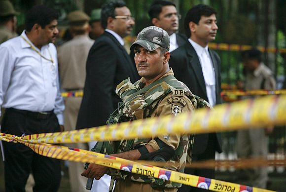 A Delhi police special force personnel keeps vigil