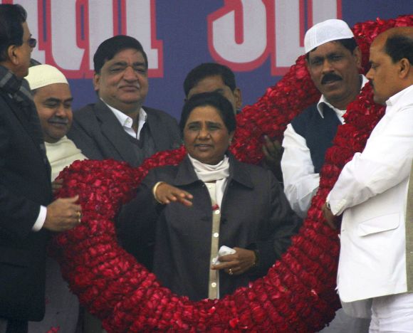 Mayawati greeted by BSP workers during a poll campaign in Lucknow