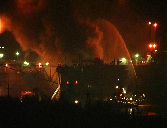 Firefighters work to extinguish fire at the Roslyakovo shipyard in the northern Russian region of Murmansk, in this still image taken from video