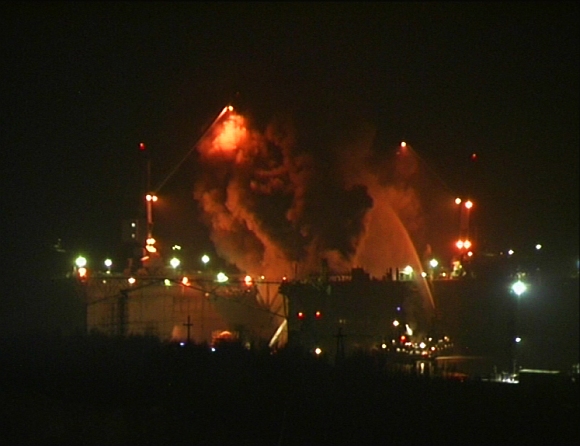 Firefighters work to extinguish fire at the Roslyakovo shipyard in the northern Russian region of Murmansk, in this still image taken from video