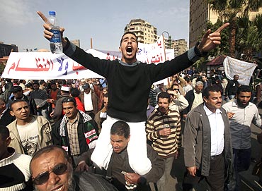 A protester gestures during an anti-Mubarak protest in Cairo onm Tuesday