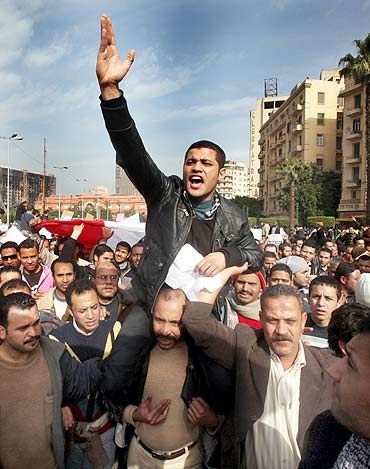 A protester gestures during an anti-Mubarak protest in Cairo on Tuesday