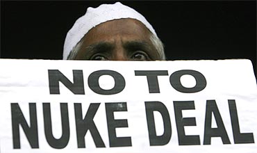 An activist holds a placard to protest against the nuclear deal