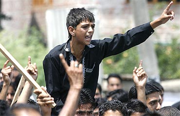 Kashmiri protesters shout slogans during an anti-India protest in Srinagar