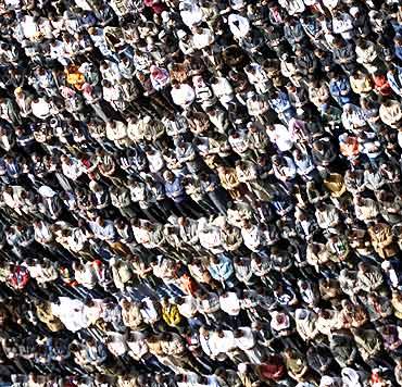 Anti-government protesters take part in Friday prayers at Tahrir Square in Cairo