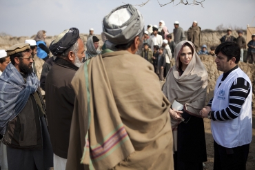 Jolie is greeted by village elders upon arrival in Qala Gudar village in Qarabagh District