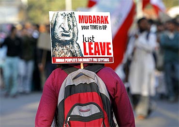 A student activist attends a protest against President Mubarak outside the Egyptian embassy in New Delhi