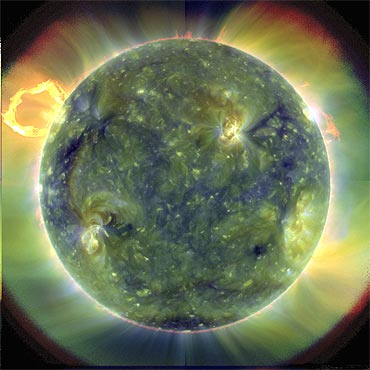 An extreme ultraviolet image, using false colours to trace different gas temperatures, of the sun taken by the Solar Dynamics Observatory