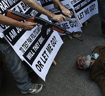 A mock execution being staged during a protest against Raymond Davis in Pakistan