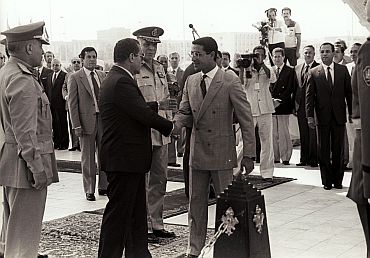 Mubarak (left), shaking hands with Gamal Sadat, the son of the late Anwar Sadat, during celebrations marking the 12th anniversary of October 1973 war with Israel, in Cairo on October 6, 1985