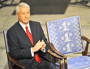 Norwegian Nobel Committee chairman Thorbjorn Jagland applauds next to the empty chair meant for Liu Ziaobo at the Nobel Peace Prize ceremony
