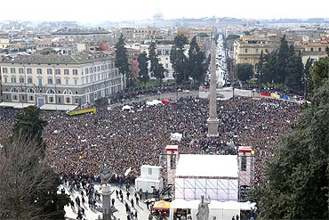 People gather in Rome's Piazza del Popolo to demonstrate against Italy's Prime Minister Silvio Berlusconi